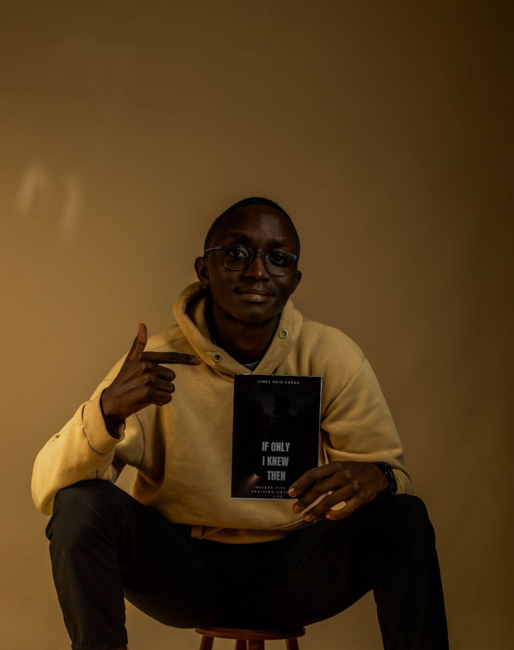 James Kojo Boadu with his books